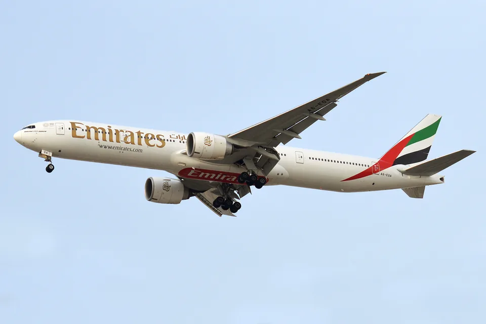 Emirates Boeing 777 A6-EQA airborne with its landing gear extended