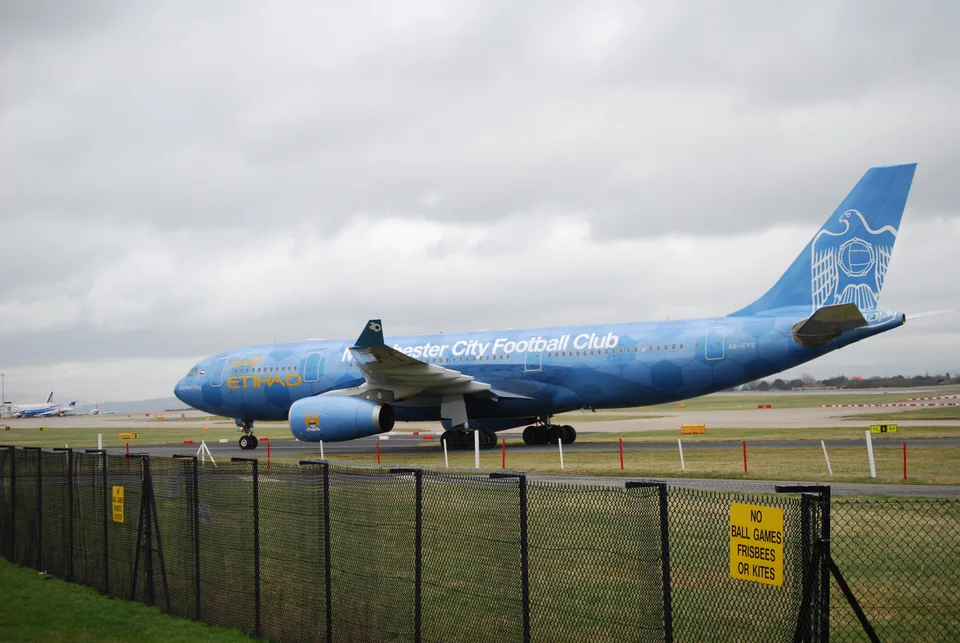 Etihad Airbus A330-243 A6-EYE in blue Manchester City colours at Manchester Airport.