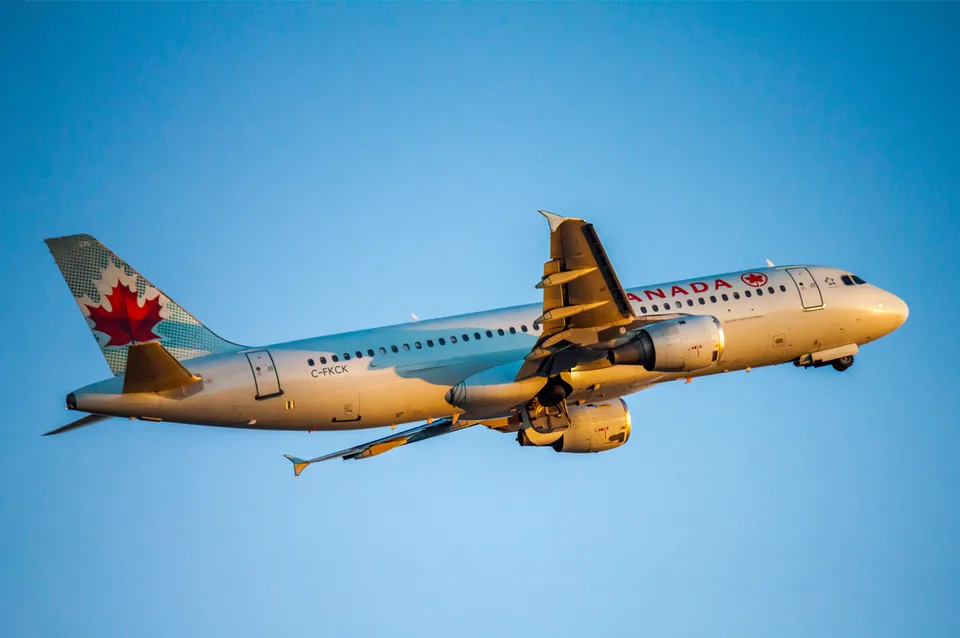 Air Canada Airbus A320-211 C-FKCK taking off with its registration visible on the fuselage.