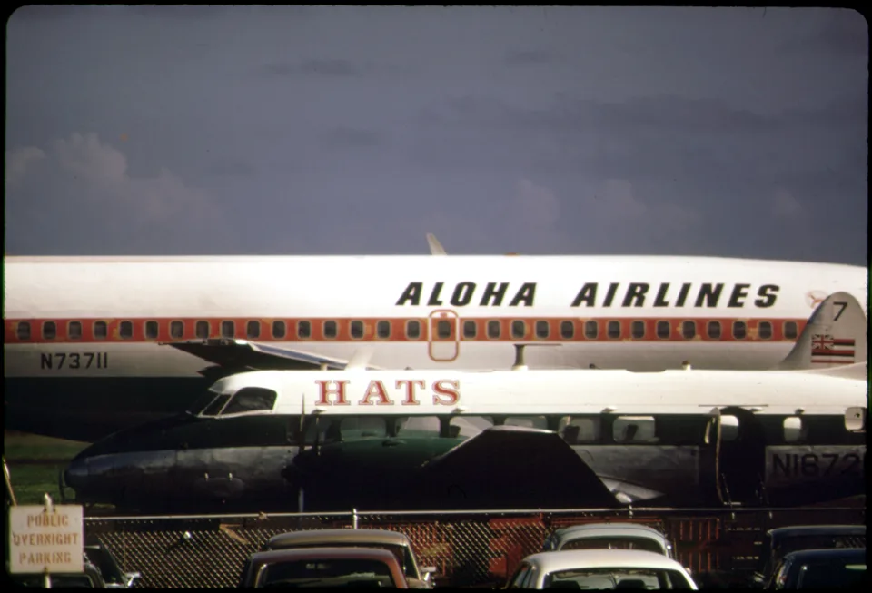 Aloha Airlines Boeing 737 N73711 behind another aircraft.