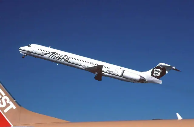 Alaska Airlines MD-83 N963AS airborne, with rear-mounted engines and a high horizontal tail.