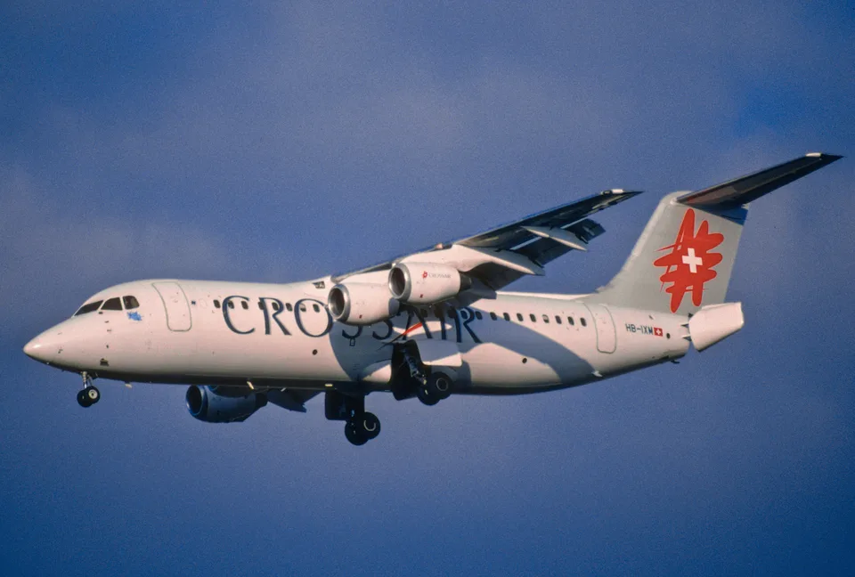 Crossair AVRO RJ100 HB-IXM in flight with landing gear extended at Zurich.