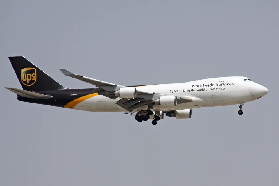 UPS Boeing 747-44AF N571UP airborne with landing gear extended.