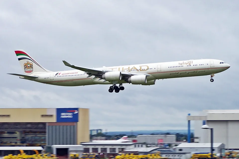 Etihad Airways Airbus A340-600 A6-EHF with landing gear extended.