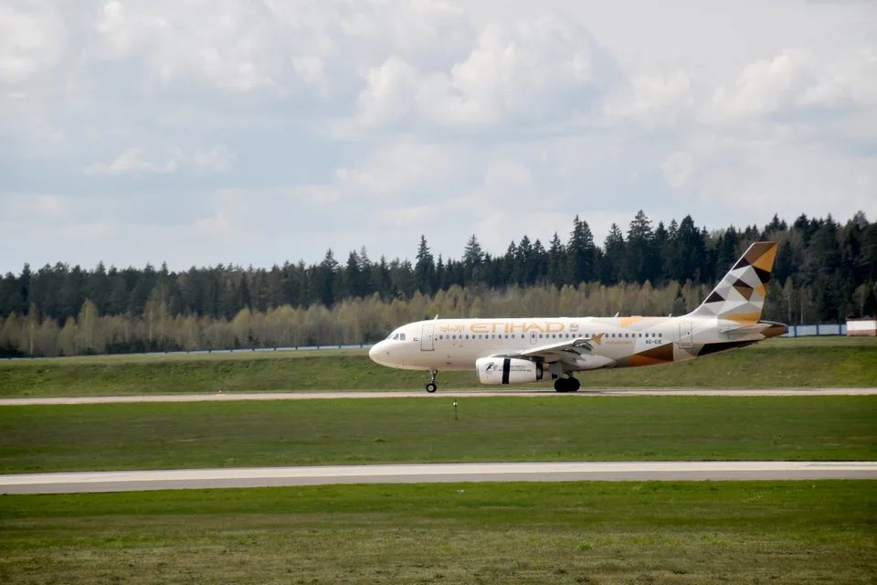 Etihad Airways Airbus A319 A6-EIE landing at Minsk.