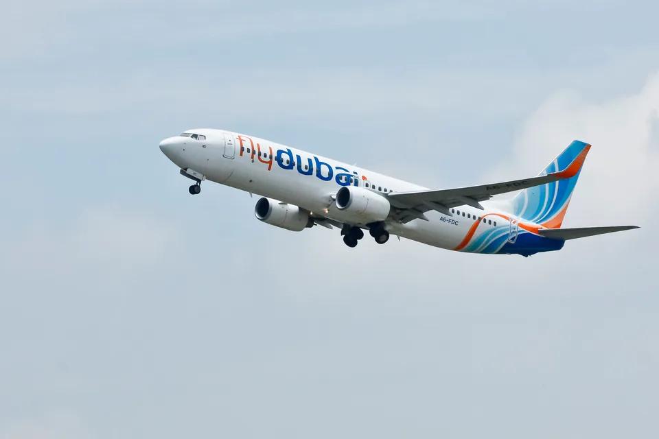flydubai Boeing 737-800 A6-FDC climbing with its landing gear retracting.