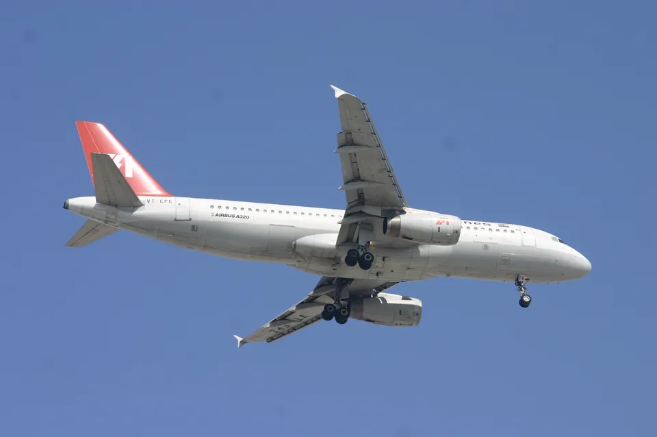 Indian Airlines Airbus A320 VT-EPE in flight with landing gear extended