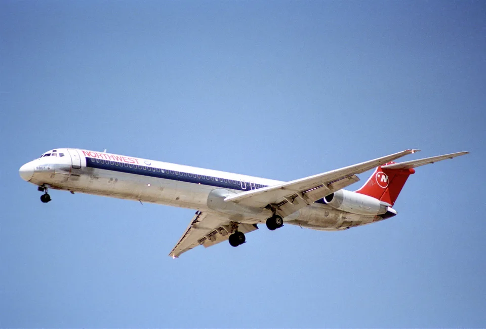 Northwest Airlines MD-82 N301RC flying with landing gear extended