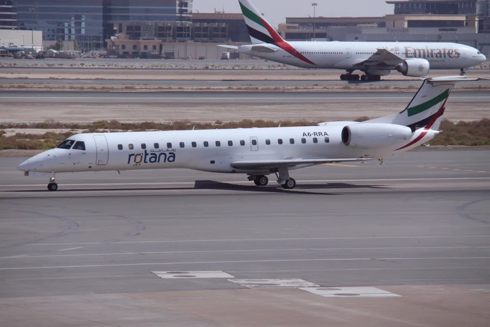 Rotana Jet Embraer A6-RRA taxiing at Dubai International Airport