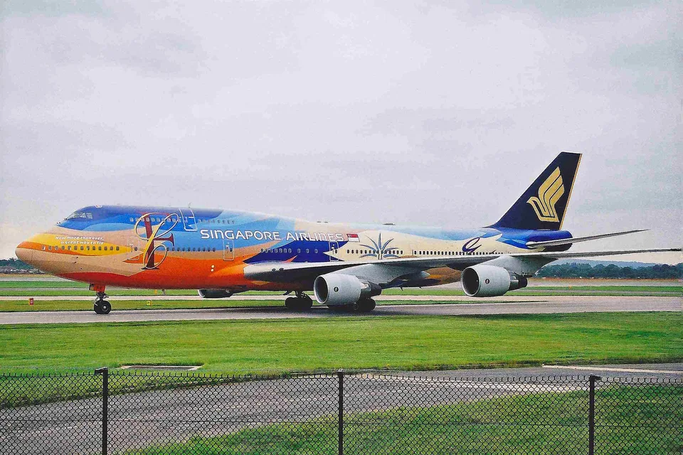 Singapore Airlines Boeing 747 9V-SPK in the colorful Raffles livery at Manchester.