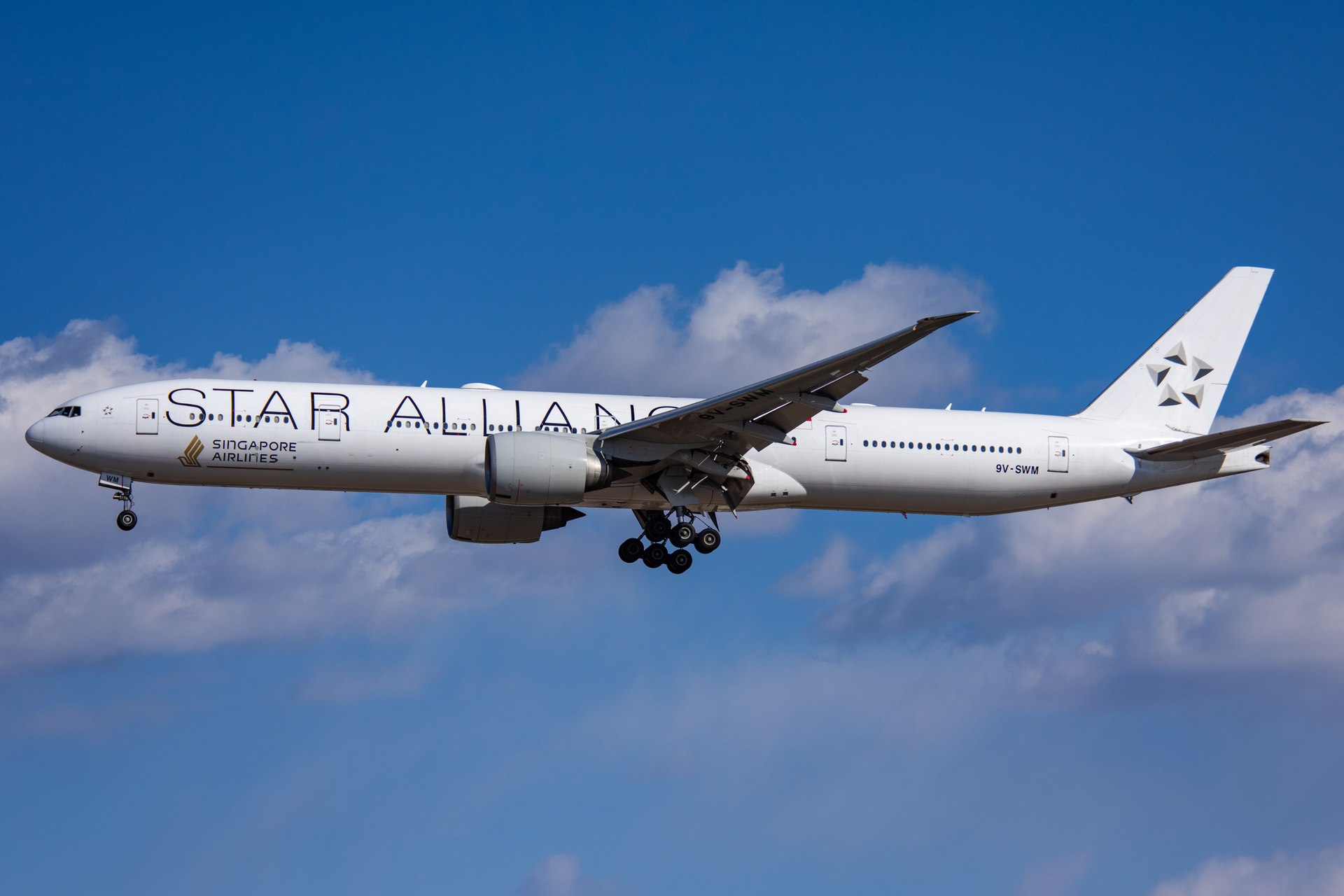 Singapore Airlines Boeing 777 9V-SWM in Star Alliance colours approaching Beijing Capital Airport.