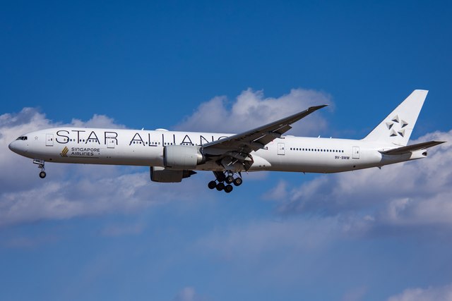 Singapore Airlines Boeing 777 9V-SWM in Star Alliance colours approaching Beijing Capital Airport.