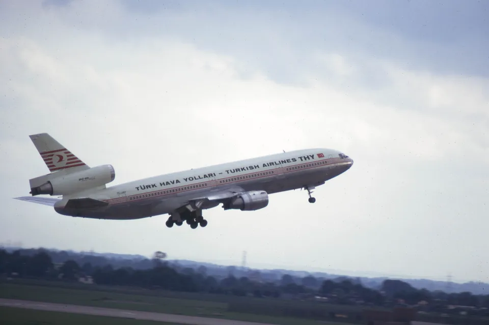 Turkish Airlines DC-10 TC-JAV in flight with landing gear extended.